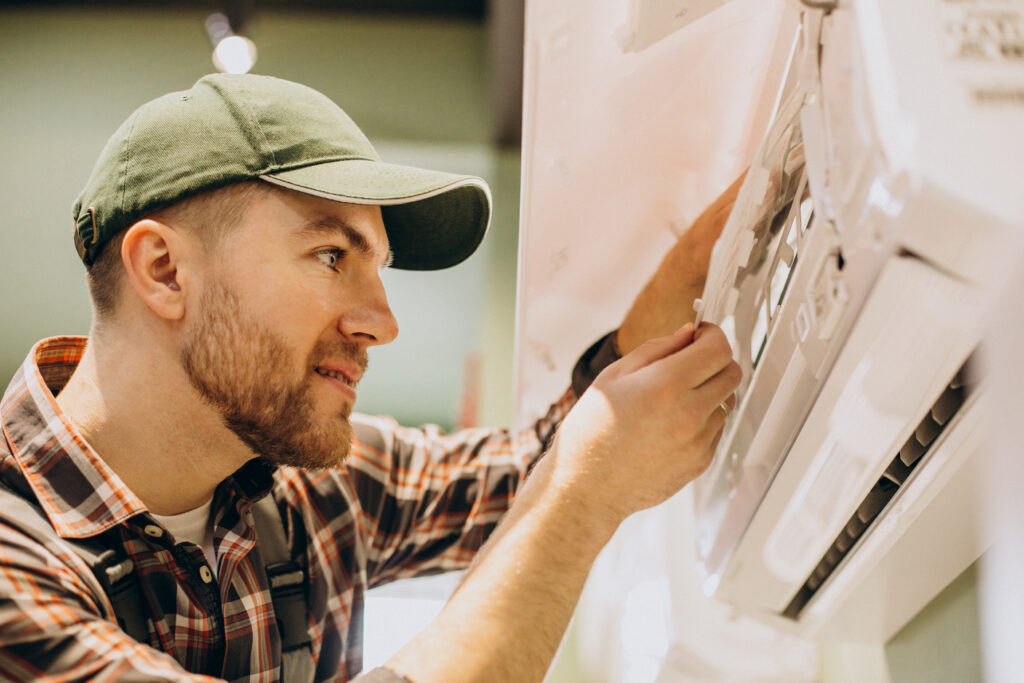 repairman doing air conditioner servise